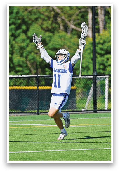 A man wearing a white and blue uniform is running on a field. Description generated by AI
