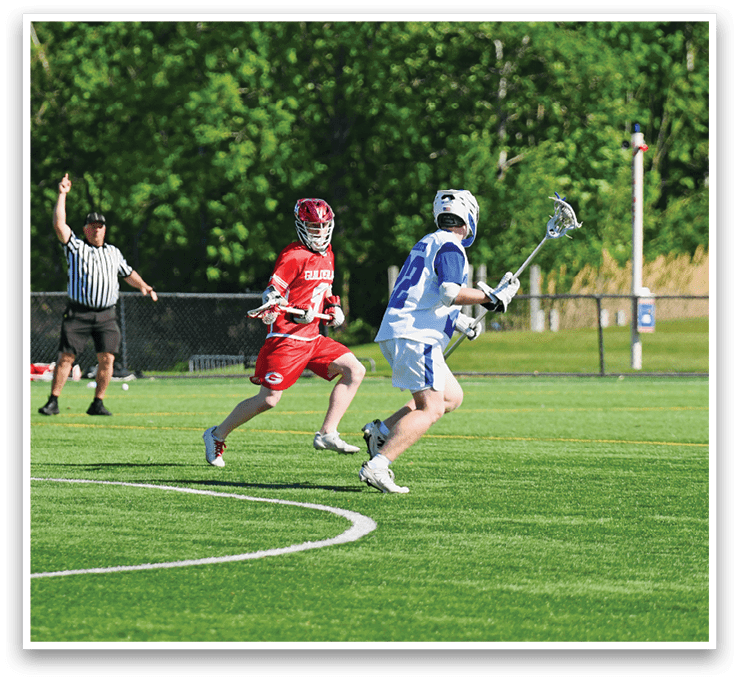 A man in a red shirt and white shorts is running on a field. Description generated by AI