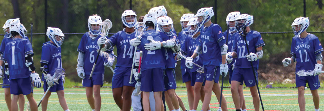 A group of people wearing blue and white uniforms. Description generated by AI