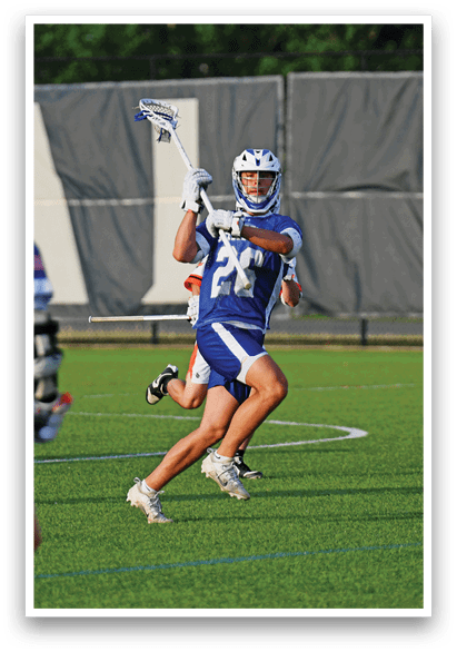 A man in a white jersey is running with a blue and white stick. Description generated by AI