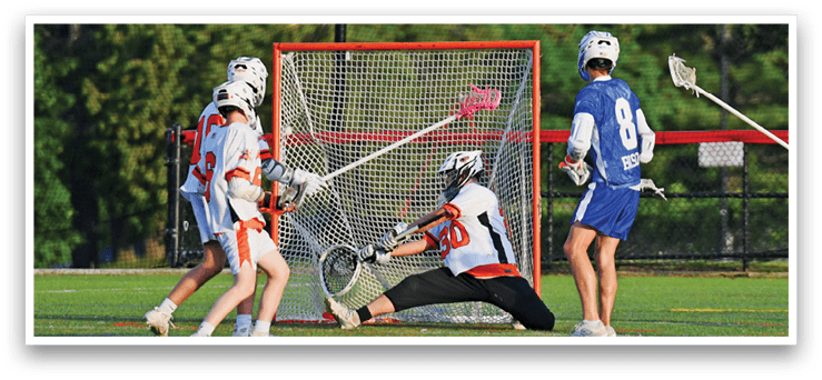 A man in a blue and white uniform is running with a lacrosse stick. Description generated by AI