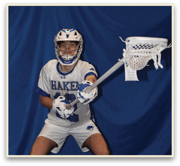 A man wearing a white uniform and a blue helmet holds a lacrosse stick. AI generated content