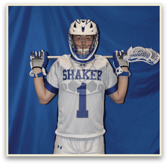 A man wearing a white jersey with the number 1 on it holds two lacrosse sticks. AI generated content