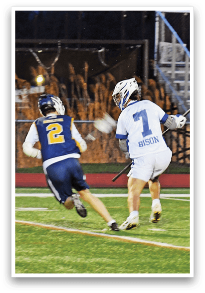 Two men are playing a game of lacrosse on a field. One player is running with a stick, while the other player is running with a stick and a ball. AI generated content