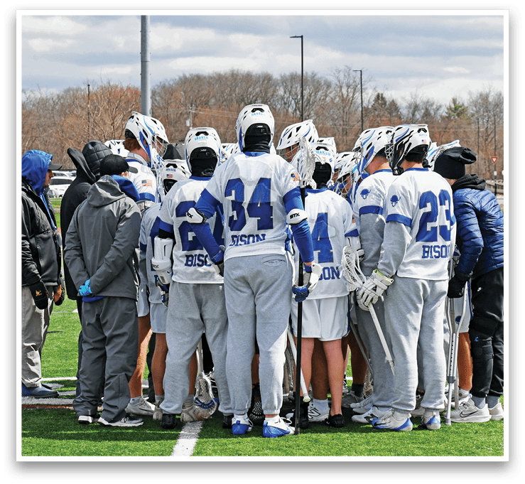 A group of people wearing white uniforms are huddled together on a field. AI generated content