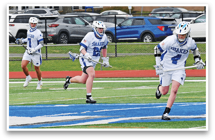 Three men are playing a game of lacrosse on a field. AI generated content