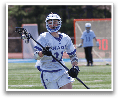 A man in a white and blue uniform is running with a lacrosse stick. AI generated content