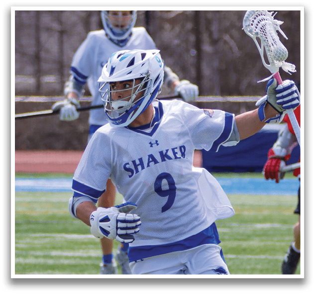 A man wearing a white jersey with the number 9 on it is running with a lacrosse stick in his hand. AI generated content