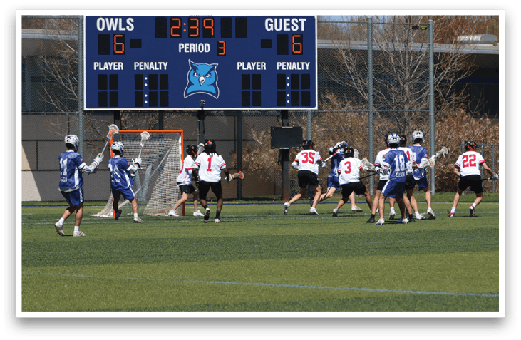 A group of young men playing a game of lacrosse on a field. AI generated content