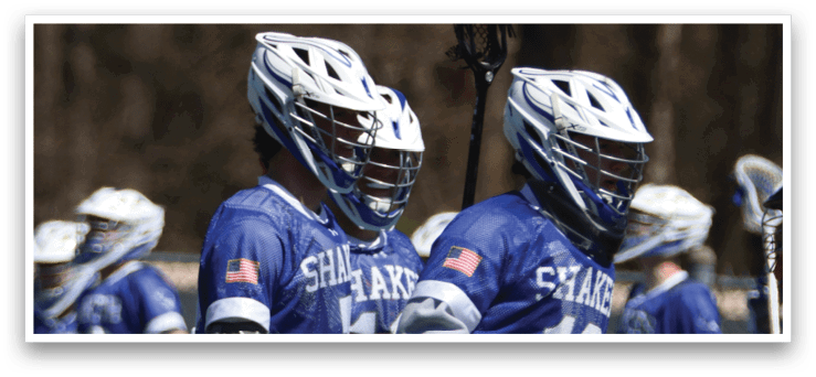 A group of people wearing blue and white uniforms are walking on a field. They are holding lacrosse sticks and appear to be talking to each other. AI generated content