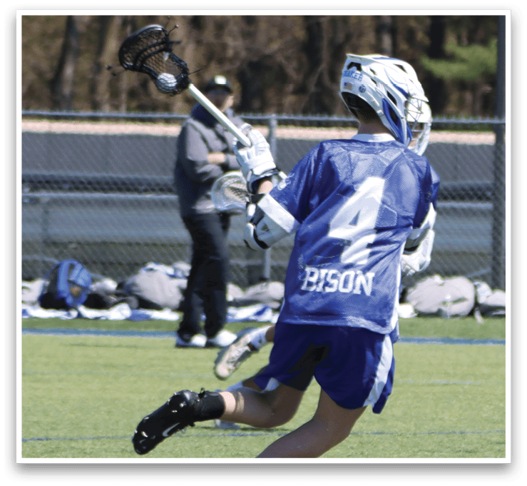 A man wearing a blue and white jersey is running with a lacrosse stick in his hand. AI generated content