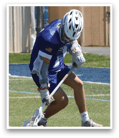 A man in a blue and white uniform is holding a hockey stick and bending over on a field. AI generated content