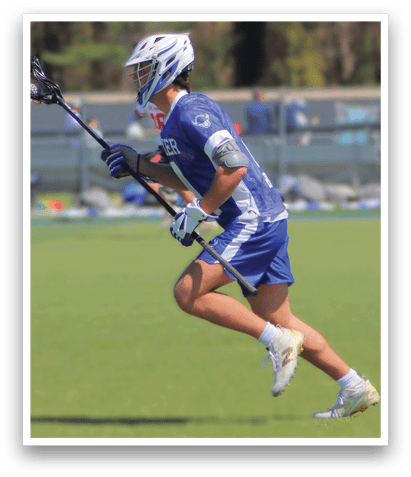 A man wearing a blue and white uniform is running on a field while holding a lacrosse stick. AI generated content