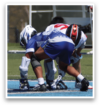 Two men are playing a game of lacrosse. One man is bent over with his head down, while the other man is standing behind him. AI generated content
