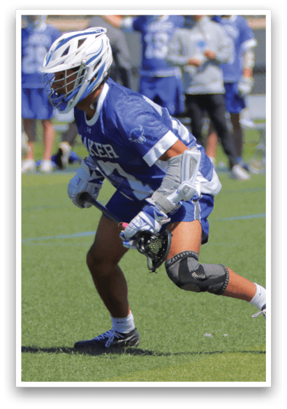 A lacrosse player wearing a blue and white uniform is running on the field. AI generated content