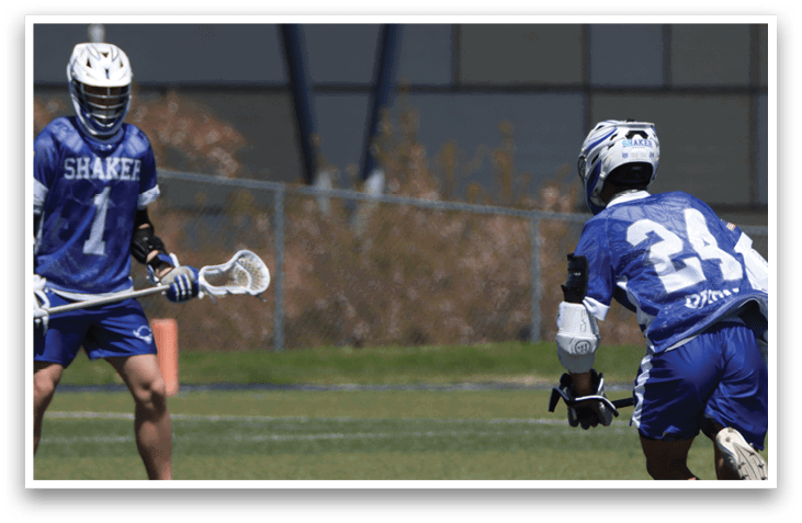 Two men playing lacrosse on a field. AI generated content