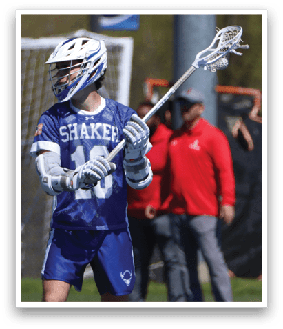 A man wearing a blue and white jersey holds a lacrosse stick. AI generated content