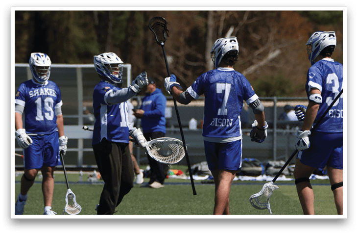A group of lacrosse players are on the field, celebrating a victory. AI generated content