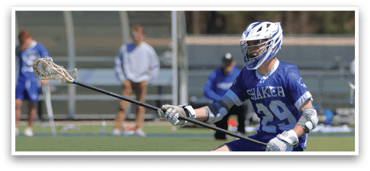A man in a blue and white uniform is holding a lacrosse stick, preparing to play. AI generated content