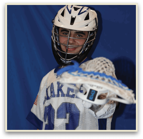 A young man wearing a Lake 13 jersey and a helmet is holding a lacrosse stick. AI generated content