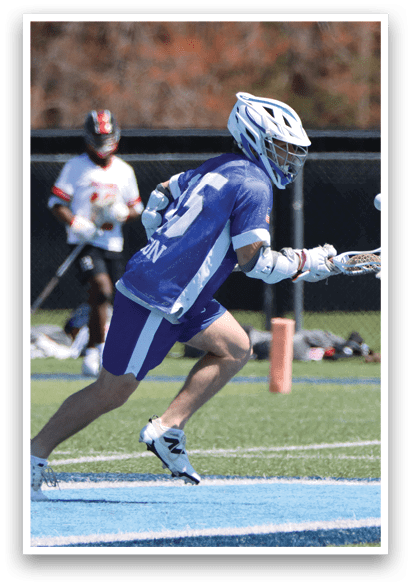 A man wearing a blue and white uniform is playing baseball. He is running towards a base while holding a baseball bat. AI generated content