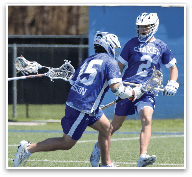 Two lacrosse players from opposing teams are running towards the goal, both holding their sticks. AI generated content