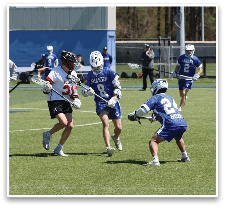 A group of men playing a game of lacrosse on a field. AI generated content