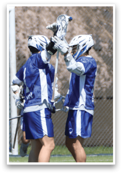 Two men wearing blue and white uniforms are holding their lacrosse sticks above their heads, celebrating a goal. AI generated content