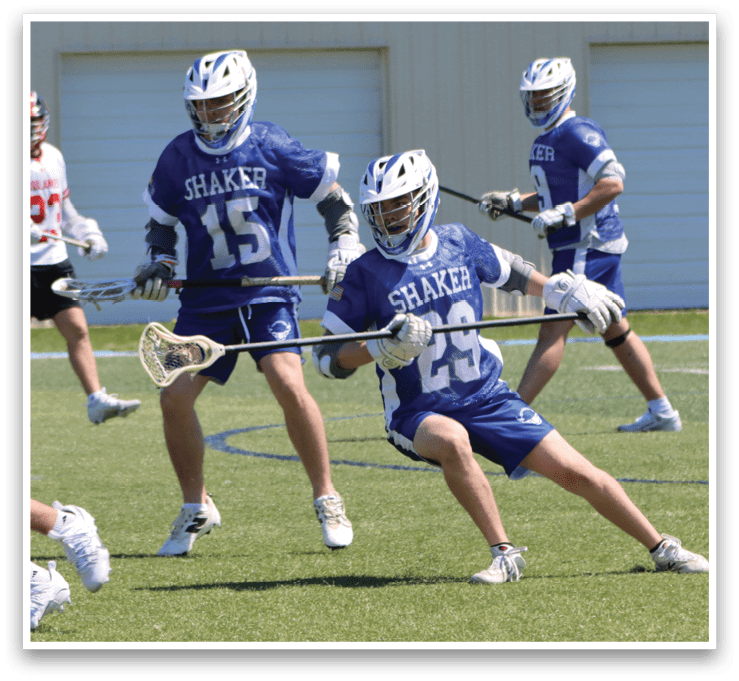 A group of young men playing lacrosse on a field. AI generated content