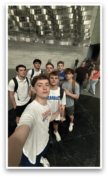 A group of young men pose for a picture in front of a building. AI generated content