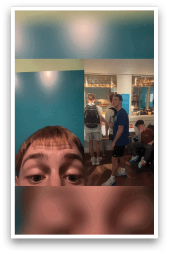 A group of people are standing in a room, with one person looking at the camera. There are three other people in the background, and a chair is visible in the room. AI generated content