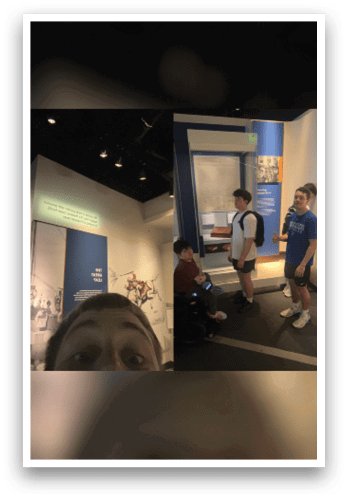 A group of people are standing in a museum, looking at a display. AI generated content