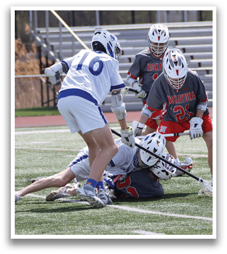 Three boys playing lacrosse on a field. One boy is falling to the ground while another is holding a stick. AI generated content