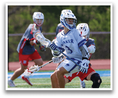 A lacrosse player in a red uniform is about to be hit by another player. AI generated content