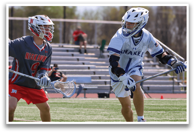 Two men playing lacrosse on a field. One man is wearing a red shirt and the other is wearing a blue and white shirt. AI generated content