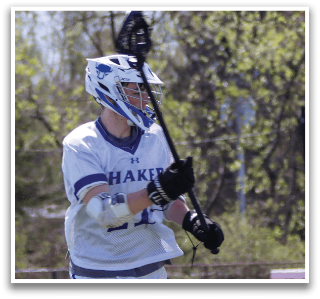 Two men playing lacrosse on a field. One is running with a stick, while the other is holding a stick and wearing a helmet. AI generated content