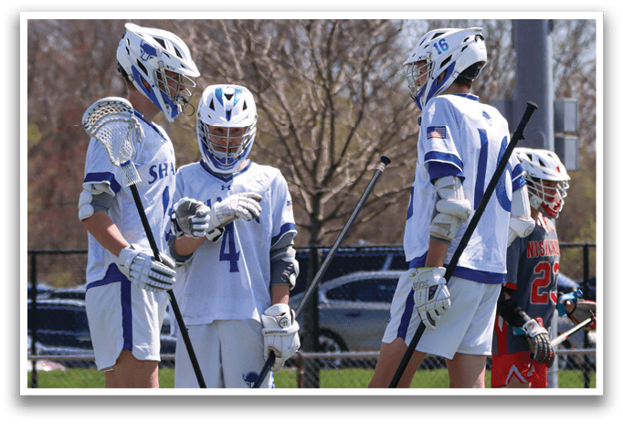 Three lacrosse players standing on a field, holding their sticks. AI generated content