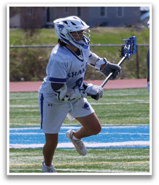 Two people playing lacrosse on a field. AI generated content