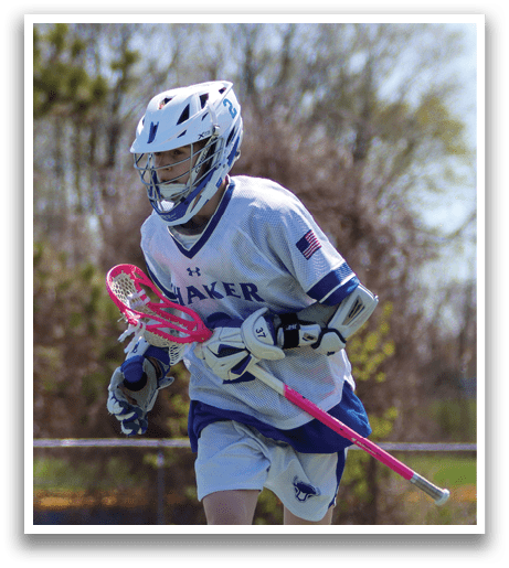 A lacrosse player in a white and blue uniform is running on a field. AI generated content