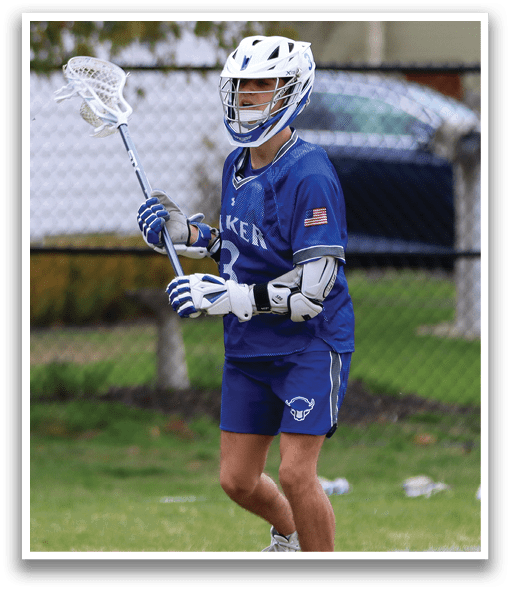 A person wearing a blue and white uniform is holding a lacrosse stick and walking on a field. AI generated content