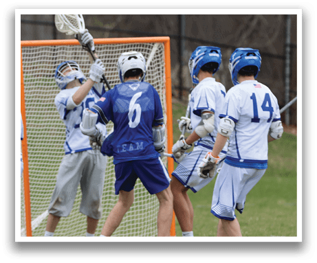 A group of lacrosse players are playing in a game. One player is attempting to score a goal by hitting the ball with his stick. The other players are trying to defend their goal. AI generated content