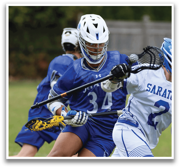 Two lacrosse players are running on a field, one with a blue uniform and the other with a white uniform. AI generated content