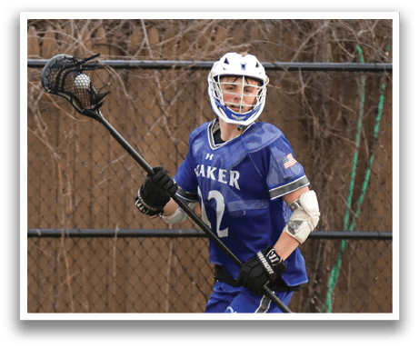 A man wearing a blue and white jersey is running with a lacrosse stick. AI generated content