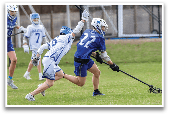 A group of young men playing a game of lacrosse on a field. AI generated content