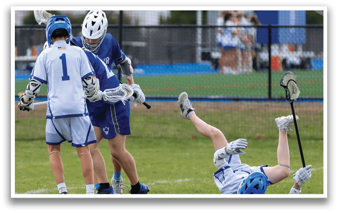 A group of young men playing a game of lacrosse. One player is falling to the ground while holding a stick. AI generated content