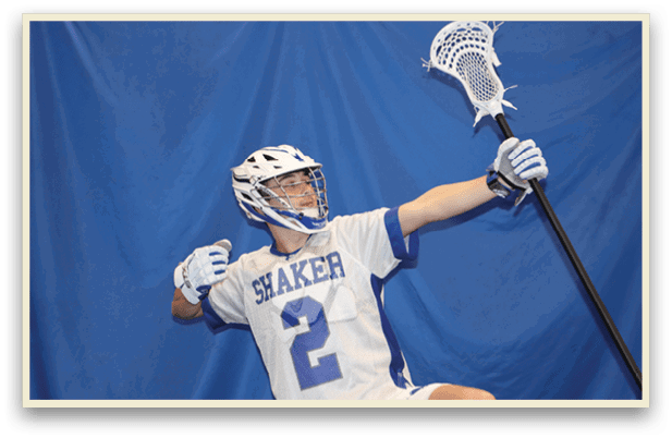 A man wearing a white and blue jersey with the number 2 on it is holding a lacrosse stick. AI generated content