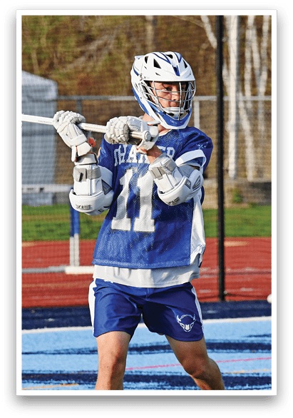 A man wearing a blue and white jersey is holding a lacrosse stick. AI generated content