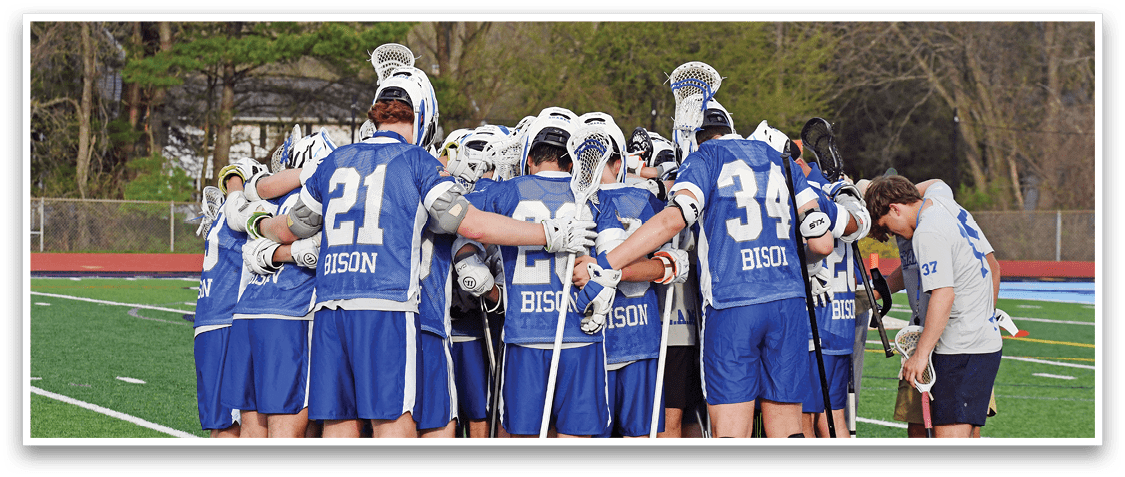 A group of young men in blue and white uniforms are huddled together on a field. AI generated content