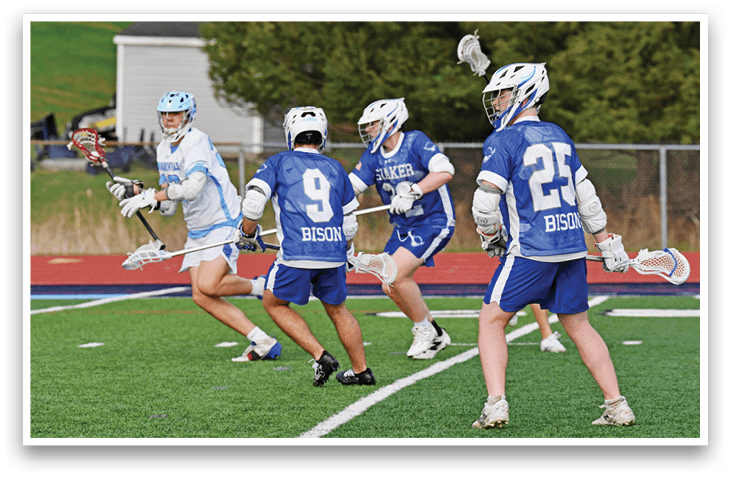 A group of young men playing a game of lacrosse on a field. AI generated content