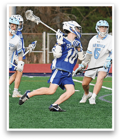 A group of lacrosse players on a field, one of them running with a stick. AI generated content